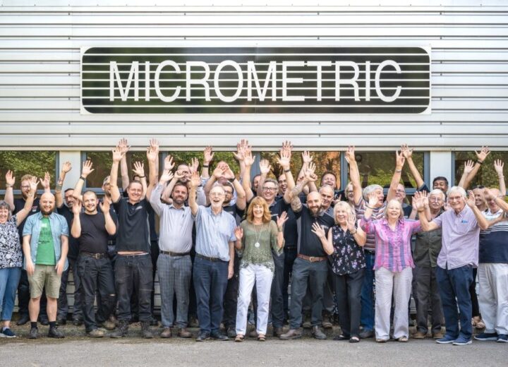Large staff group picture outside Micrometric